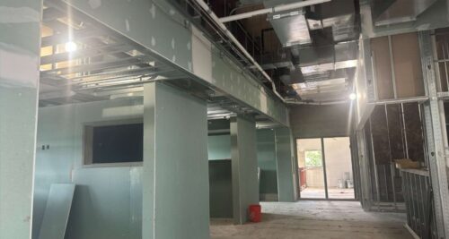 Mitchell drywall in student locker area from July 2026